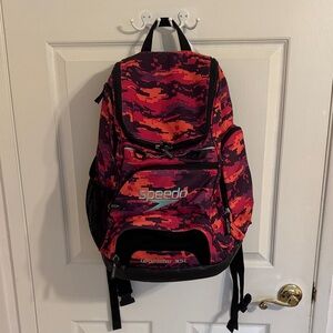 Speedo Teamster 35L backpack lightly used.  Red/orange/purple w/black trim. EUC.